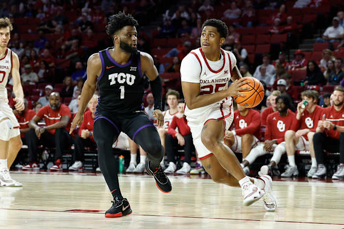Oklahoma Sooners guard Grant Sherfield dribbles past TCU Horned Frogs guard Mike Miles Jr.